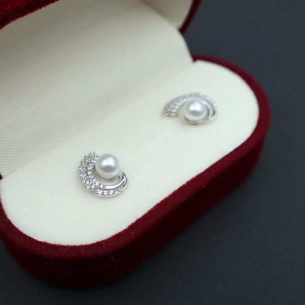 Boucles d’oreilles en perles à volute pavée