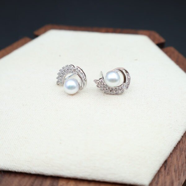 Boucles d’oreilles en perles à volute pavée